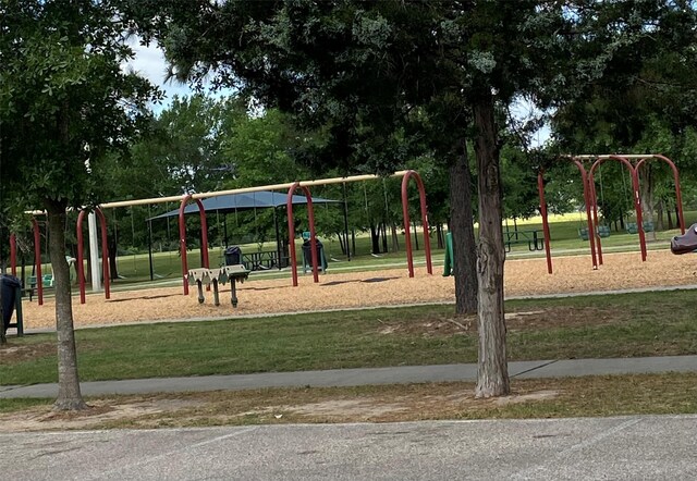 community play area with a lawn