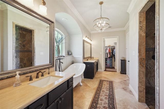 5924 Oak Leaf Ct, Conroe, TX 77304 - full bath featuring two vanities, a chandelier, a freestanding tub, ornamental molding, and a spacious closet