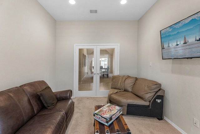 living area with french doors, recessed lighting, visible vents, and carpet floors