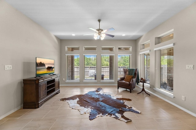 sitting room with recessed lighting, light tile patterned floors, baseboards, and a ceiling fan