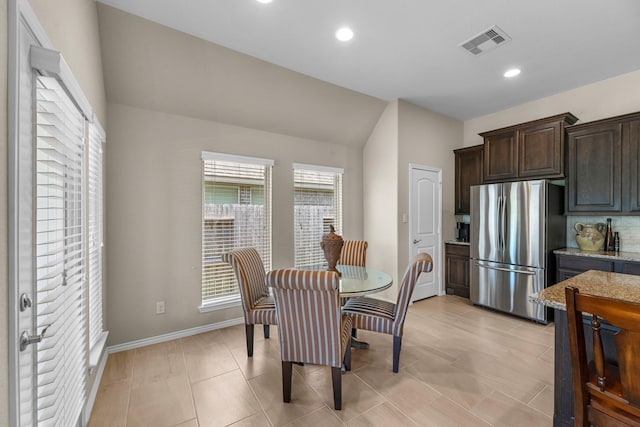 dining area featuring visible vents, baseboards, recessed lighting, and lofted ceiling