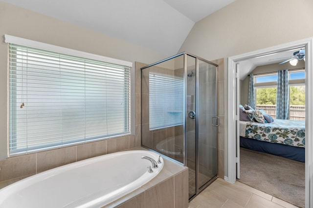ensuite bathroom featuring a shower stall, a garden tub, ensuite bath, and lofted ceiling
