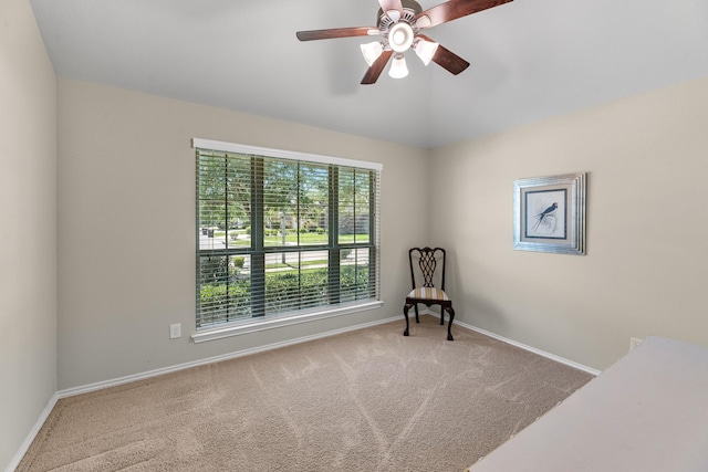 unfurnished room featuring carpet flooring, baseboards, and a ceiling fan