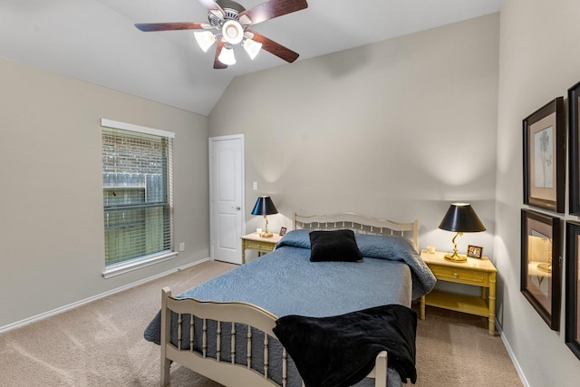 bedroom featuring light carpet, baseboards, and vaulted ceiling
