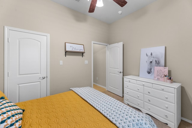bedroom with baseboards and a ceiling fan