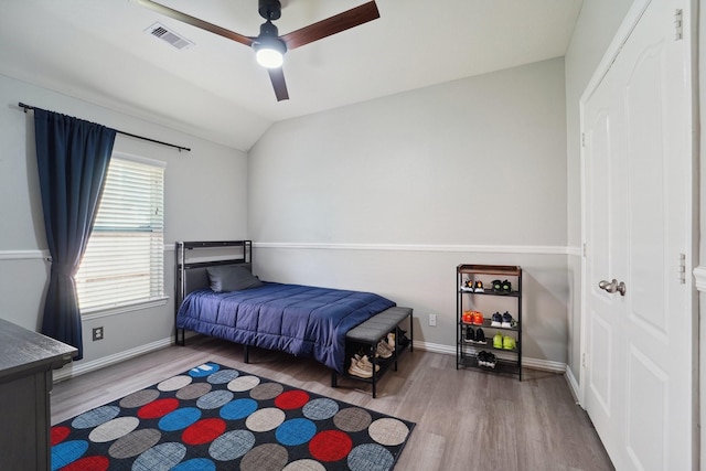 9507 Arrowhead Terrace Ln, Humble, TX 77396 - bedroom featuring visible vents, baseboards, a ceiling fan, vaulted ceiling, and wood finished floors