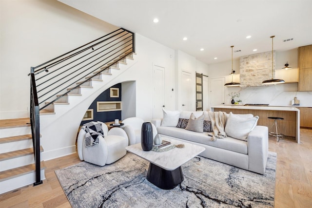 829 Alexander St, Houston, TX 77007 - living room with stairs, light wood-style floors, recessed lighting, and baseboards