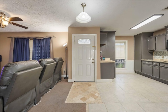 13918 Bretagne Dr, Houston, TX 77015 - foyer featuring ceiling fan, light tile patterned flooring, a textured ceiling, and visible vents