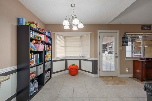 13918 Bretagne Dr, Houston, TX 77015 - interior space with tile patterned floors, baseboards, and an inviting chandelier