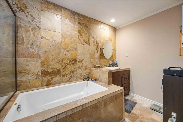 13918 Bretagne Dr, Houston, TX 77015 - bathroom featuring a tub with jets, baseboards, ornamental molding, and vanity