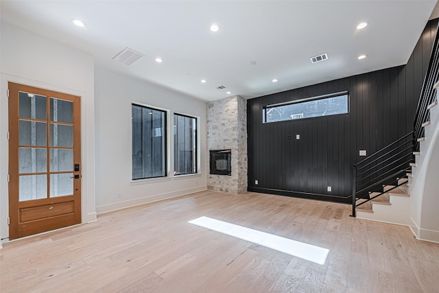 foyer with visible vents, light wood finished floors, recessed lighting, and stairs