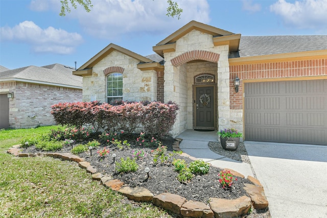 21320 Heritage Forest Ln, Porter, TX 77365 - view of front of home featuring stone siding, a garage, a shingled roof, and driveway