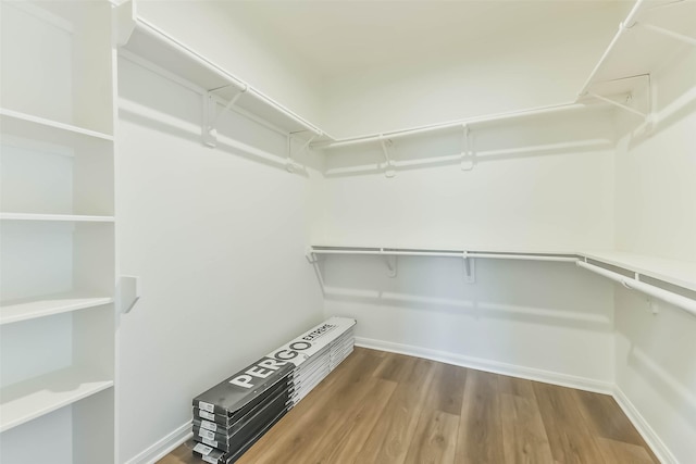 21320 Heritage Forest Ln, Porter, TX 77365 - walk in closet featuring wood finished floors