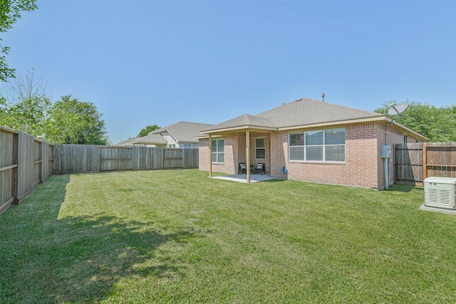 21320 Heritage Forest Ln, Porter, TX 77365 - back of house with brick siding and a patio