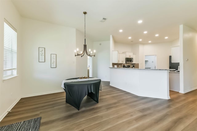21320 Heritage Forest Ln, Porter, TX 77365 - kitchen with stainless steel microwave, white cabinetry, dark wood-style floors, a chandelier, and recessed lighting