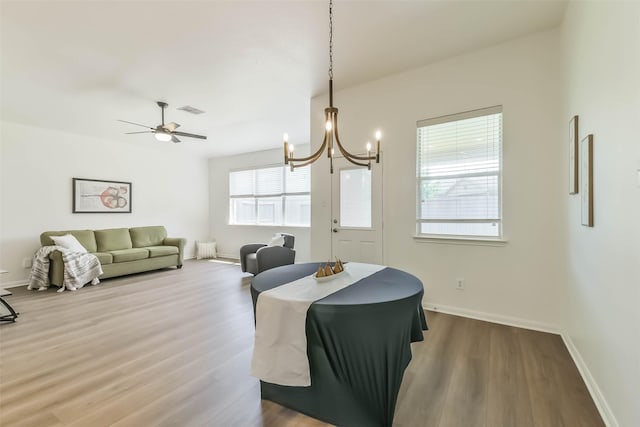 21320 Heritage Forest Ln, Porter, TX 77365 - dining area featuring wood finished floors, a chandelier, and baseboards
