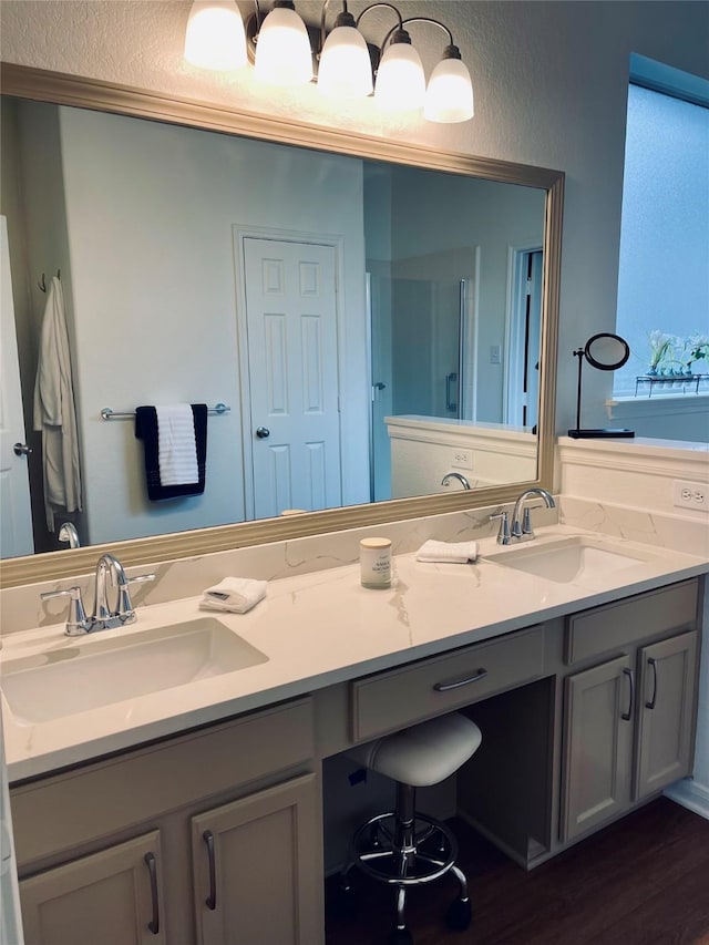 21320 Heritage Forest Ln, Porter, TX 77365 - full bathroom with a shower stall, double vanity, and wood finished floors