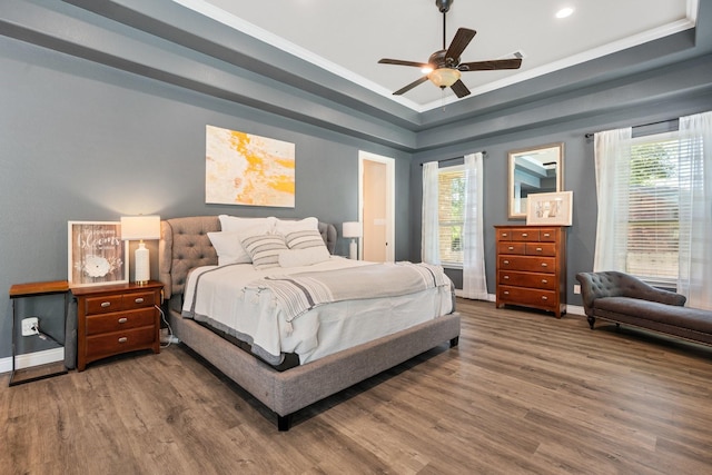 40377 Mostyn Dr, Magnolia, TX 77354 - bedroom with a raised ceiling, wood finished floors, baseboards, recessed lighting, and crown molding
