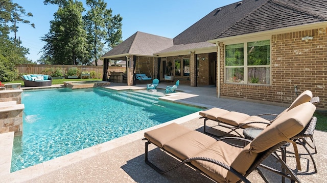 40377 Mostyn Dr, Magnolia, TX 77354 - view of swimming pool with a patio area, a fenced backyard, and a pool with connected hot tub