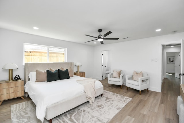 bedroom featuring light wood-type flooring, recessed lighting, connected bathroom, visible vents, and ceiling fan