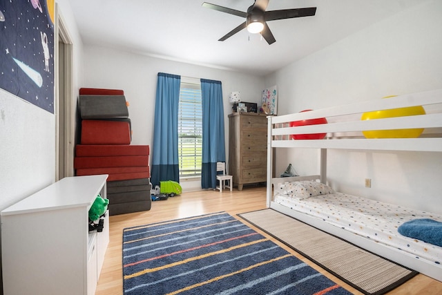 bedroom with a ceiling fan and wood finished floors