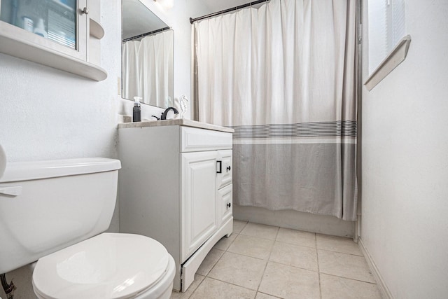 full bath with tile patterned flooring, toilet, and vanity