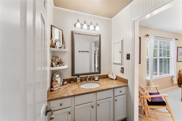 bathroom with vanity and crown molding