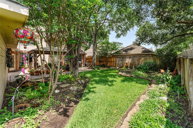 view of yard featuring a fenced backyard and a patio area