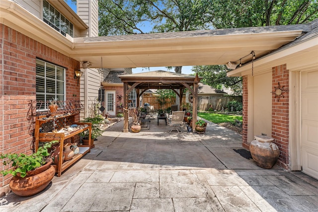 view of patio / terrace featuring a gazebo and a fenced backyard