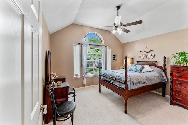 carpeted bedroom featuring baseboards, ceiling fan, and vaulted ceiling