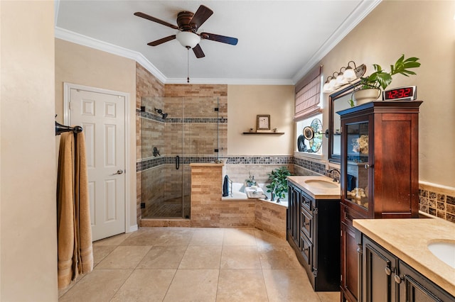 bathroom with a stall shower, a ceiling fan, two vanities, and a sink