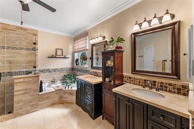 full bath with crown molding, a ceiling fan, a sink, and tile patterned floors