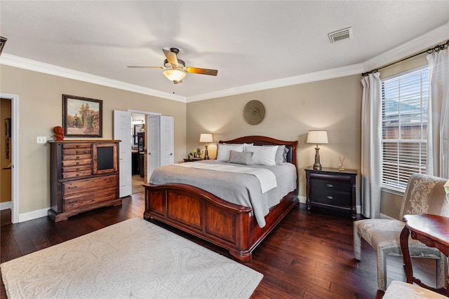 bedroom featuring crown molding, visible vents, dark wood-style flooring, and baseboards