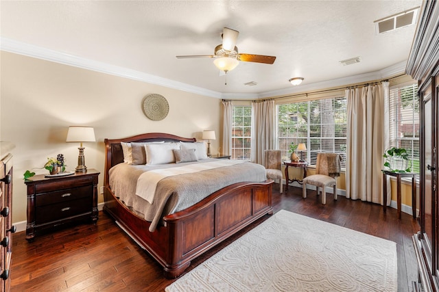 bedroom with baseboards, visible vents, ornamental molding, and dark wood-type flooring