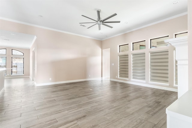 23446 Timbarra Glen Dr, New Caney, TX 77357 - unfurnished living room featuring ornamental molding, ceiling fan, light wood-style flooring, and visible vents