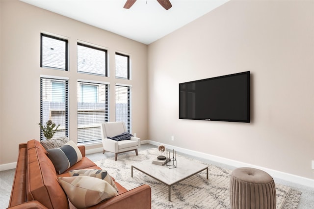 23446 Timbarra Glen Dr, New Caney, TX 77357 - carpeted living room featuring baseboards and ceiling fan