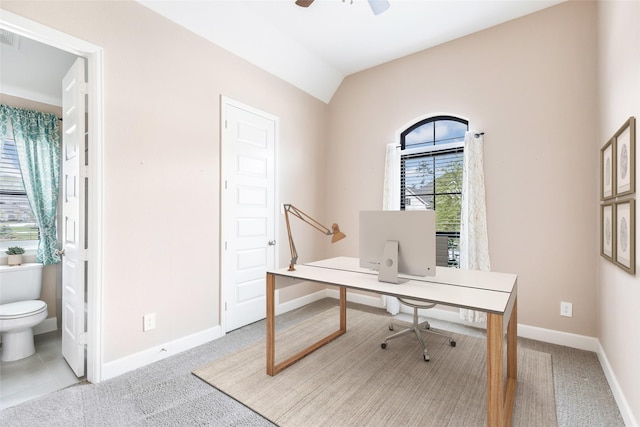 23446 Timbarra Glen Dr, New Caney, TX 77357 - office space featuring lofted ceiling, light colored carpet, ceiling fan, and baseboards
