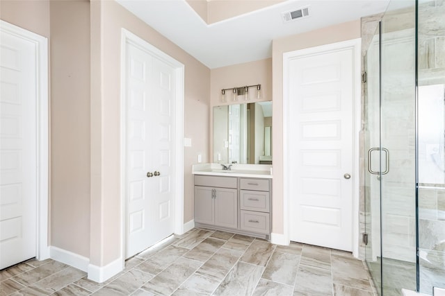23446 Timbarra Glen Dr, New Caney, TX 77357 - full bathroom featuring visible vents, a shower stall, vanity, and baseboards
