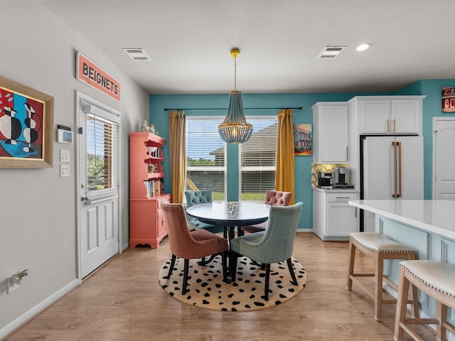 1800 Bright Way Ln, Dickinson, TX 77539 - dining room featuring a chandelier, plenty of natural light, baseboards, light wood-style floors, and recessed lighting