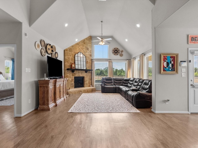 1800 Bright Way Ln, Dickinson, TX 77539 - living area with ceiling fan, wood finished floors, high vaulted ceiling, baseboards, and a stone fireplace