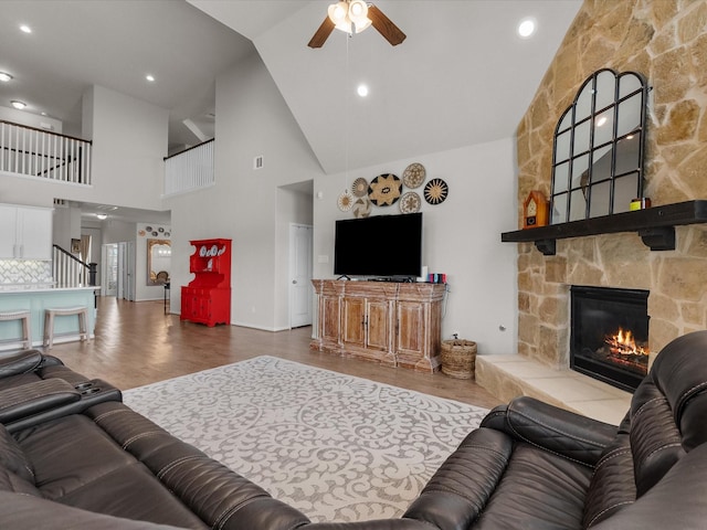 1800 Bright Way Ln, Dickinson, TX 77539 - living area with high vaulted ceiling, ceiling fan, a fireplace, and wood finished floors