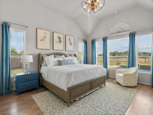 1800 Bright Way Ln, Dickinson, TX 77539 - bedroom featuring lofted ceiling, a chandelier, wood finished floors, and baseboards