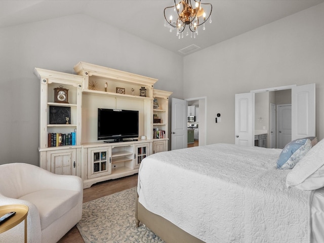 1800 Bright Way Ln, Dickinson, TX 77539 - bedroom with wood finished floors, a chandelier, and high vaulted ceiling