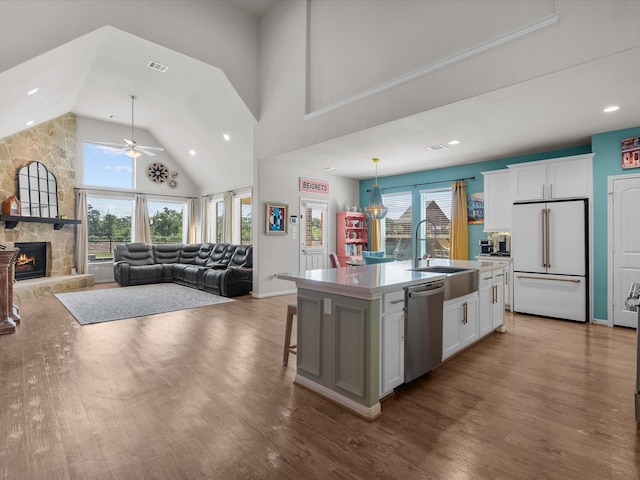 1800 Bright Way Ln, Dickinson, TX 77539 - kitchen featuring white fridge, dishwasher, a sink, a ceiling fan, and plenty of natural light