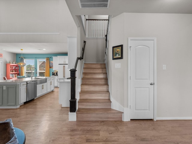 1800 Bright Way Ln, Dickinson, TX 77539 - staircase featuring wood finished floors and baseboards