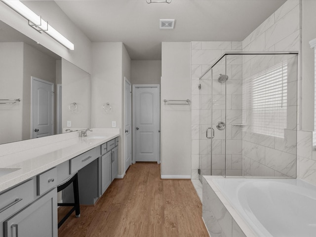 1800 Bright Way Ln, Dickinson, TX 77539 - full bathroom with a garden tub, a shower stall, double vanity, and wood finished floors