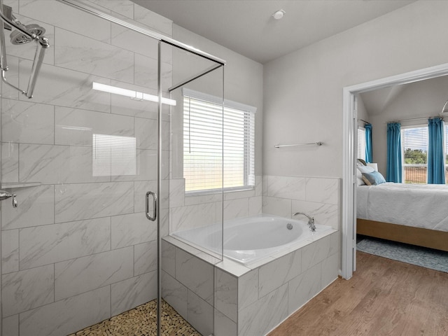 1800 Bright Way Ln, Dickinson, TX 77539 - ensuite bathroom with a bath, a shower stall, and wood finished floors