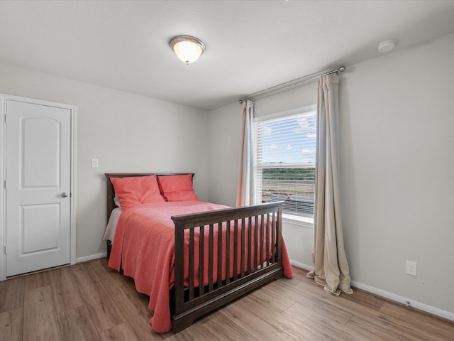 1800 Bright Way Ln, Dickinson, TX 77539 - bedroom featuring light wood-style floors and baseboards