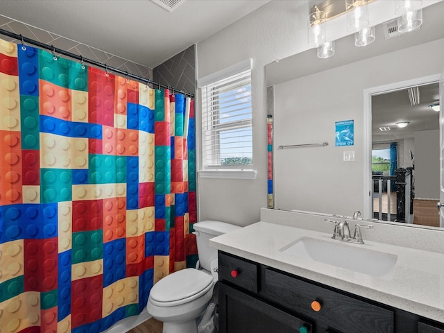 1800 Bright Way Ln, Dickinson, TX 77539 - bathroom with toilet, vanity, and a shower with curtain