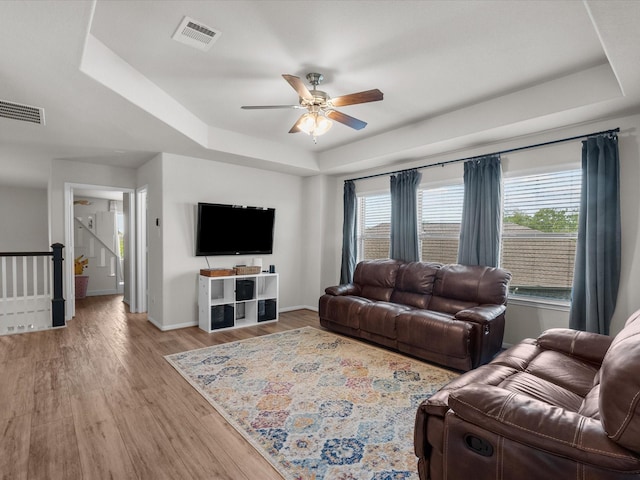 1800 Bright Way Ln, Dickinson, TX 77539 - living area with a raised ceiling, ceiling fan, baseboards, wood finished floors, and healthy amount of natural light